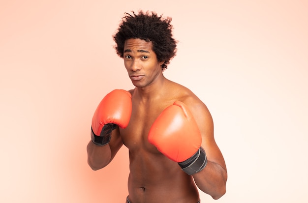 Black afro man boxing