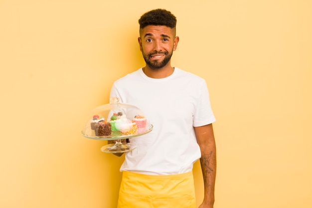 Black afro man looking puzzled and confused homemade cakes concept