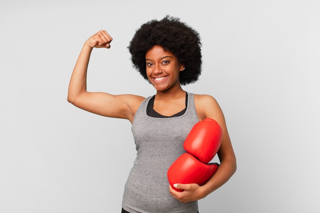 Black afro woman with boxing gloves.