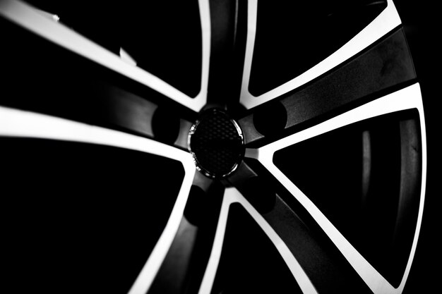 Black alloy wheels for premium cars, close-up. Purchase and replacement of autodisks.