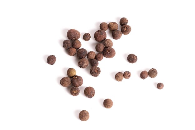 Black allspice in pea isolated on white background