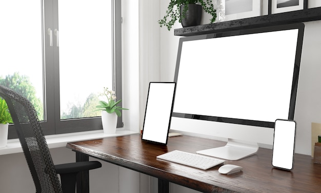 写真 空白の画面を表示する3つのデバイスを備えた白黒デスクトップ