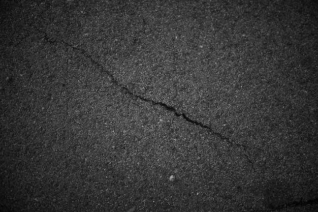 Black asphalt cracked background Old asphalt road texture Dark backdrop Grunge road illustration