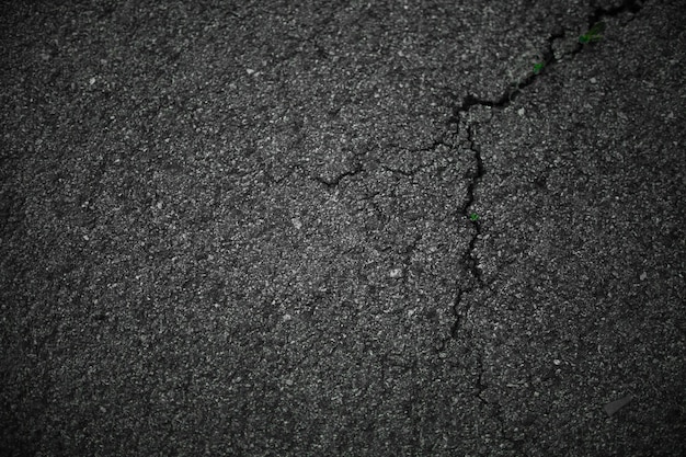 Black asphalt cracked background Old asphalt road texture Dark backdrop Grunge road illustration