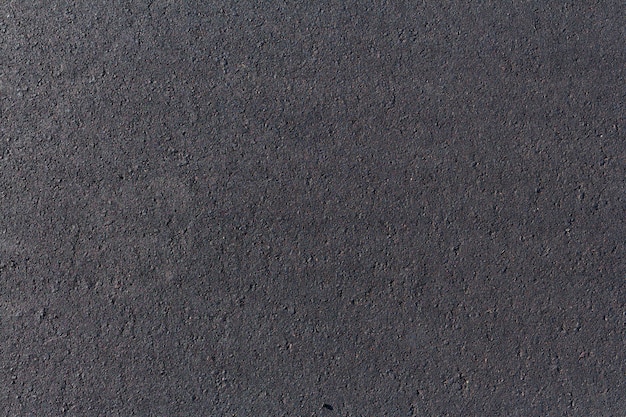 Black asphalt road, background texture close-up