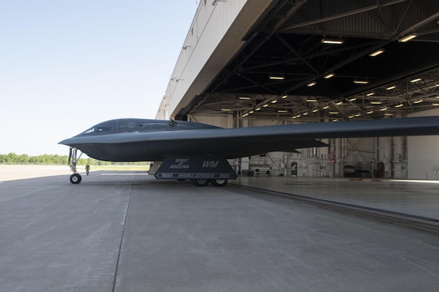 A black b - 52 is parked in a hanger.