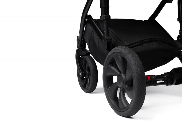 Фото Черная детская коляска, изолированная на белом
