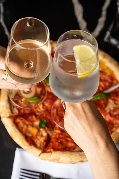 Black background and pizza tasty pepperoni pizza and cooking\
tasty traditional italian pizza