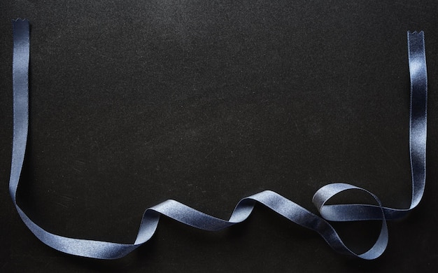Photo black background with black satin ribbon frame