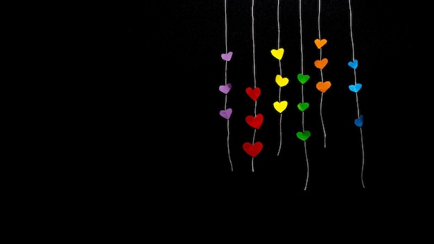 black background with coloured hearts