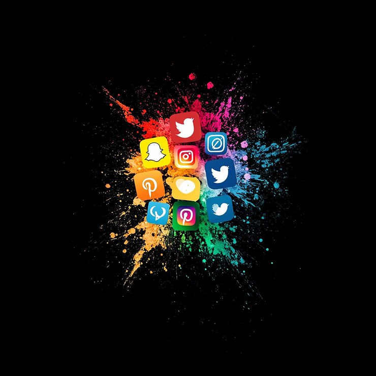 Photo black background with an explosion of colors outwards to famous social media icons