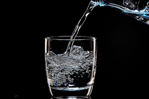 Photo black background with tap water
