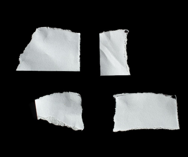 A black background with torn pieces of paper that says'paper '