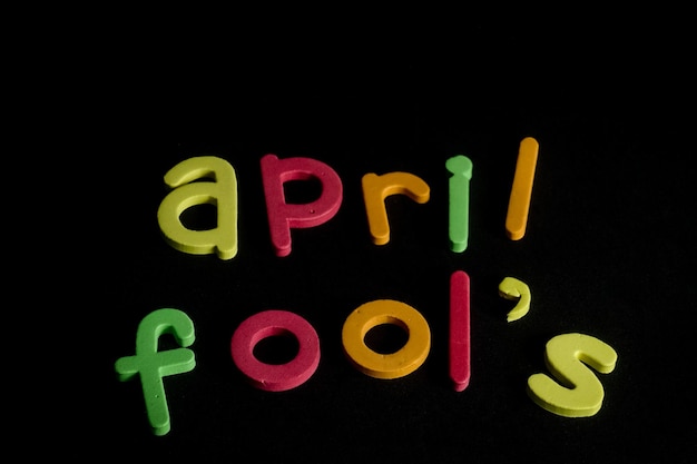 A black background with the word april fool written in yellow letters.