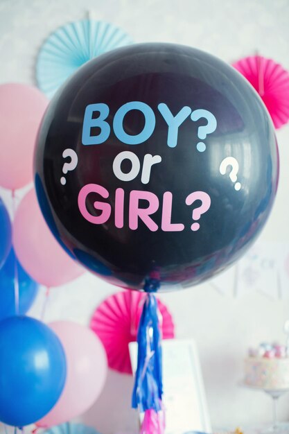 Photo black balloon with boy or girl on gender reveal party