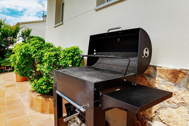 Black barbecue oven in the backyard