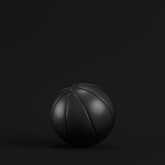 Photo black basketball ball on dark background. minimalism concept.