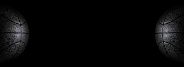 Black basketball on a black background Panorama or free space