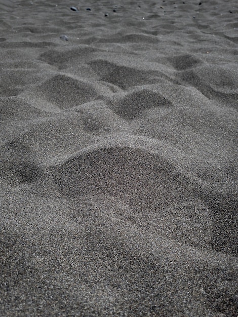 写真 黒い砂浜の砂丘の背景