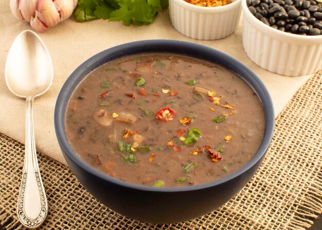 Black bean soup a hot chili with meat winter Mexican food