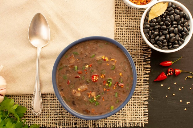 Black bean soup a hot chili with meat winter Mexican food