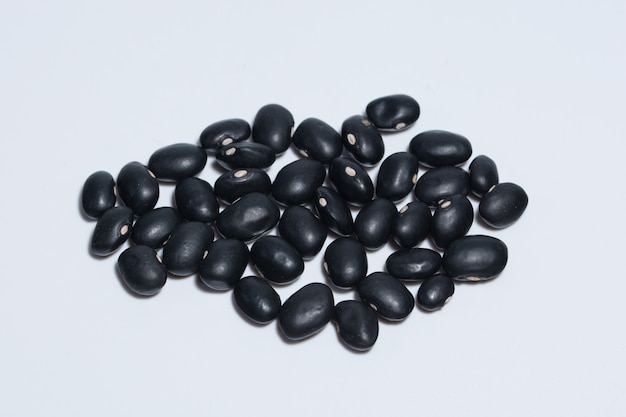 Black beans, white background.