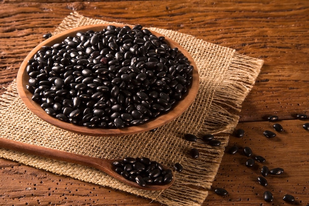 black beans on wooden table