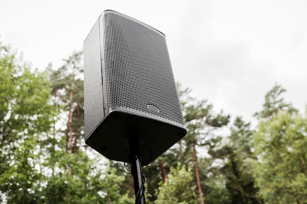 Black big speaker on stand outdoor