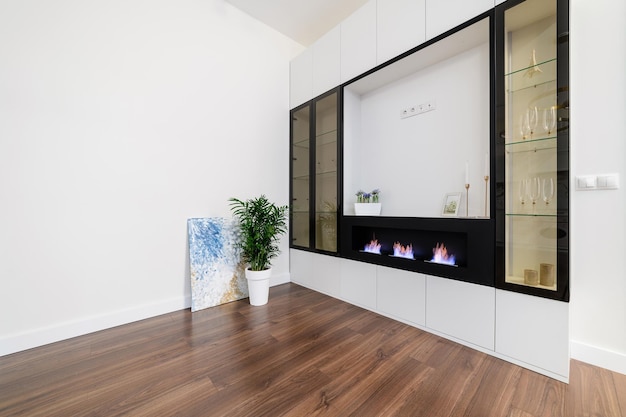 Black bio fireplace with fire in a new house