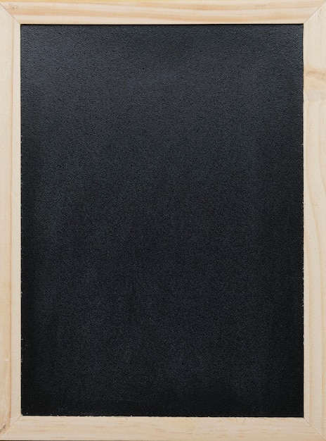 Black blackboard wooden frame with traces white chalk stains