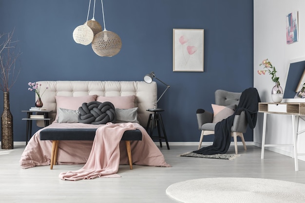 Black blanket on grey armchair