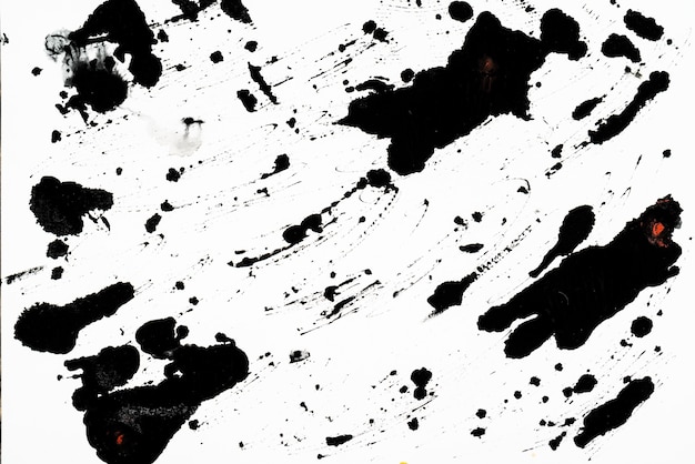 Black blots and spots on a white background.