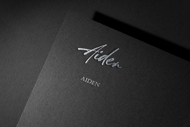 Black book with the name " aben " on the front.