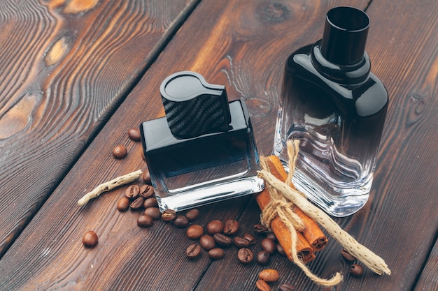 Black bottle of perfume placed on a wooden table