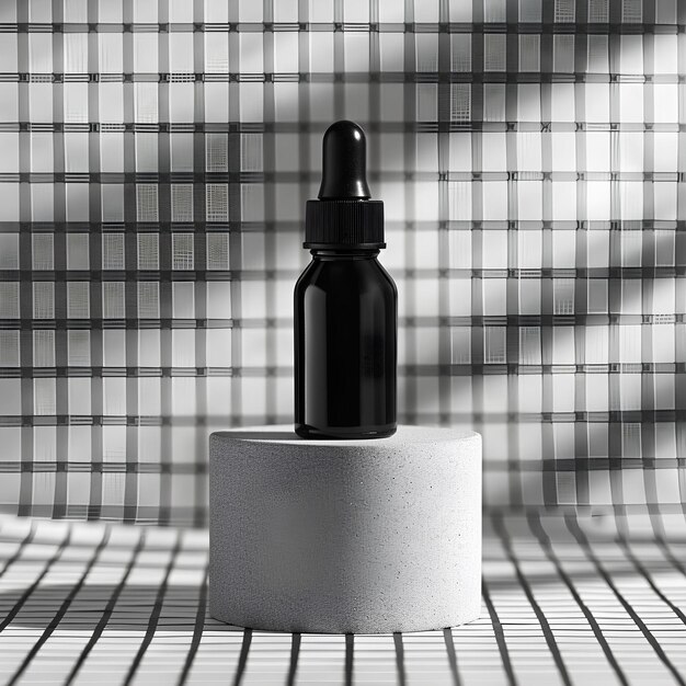 Black bottle of serum on top of square frame and background