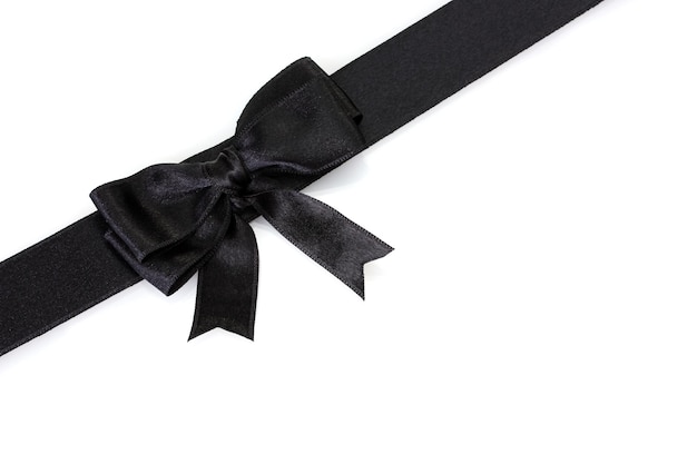 Photo black bow on ribbon isolated on white