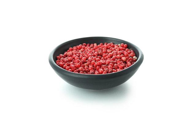 Black bowl of red peppercorns isolated on white background