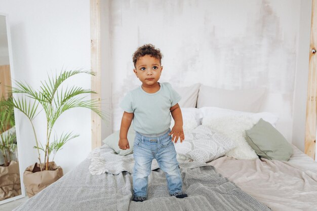 Black boy on the bedportrait of an african american child