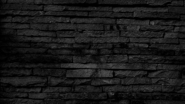 黒レンガの壁の背景暗い石のテクスチャ