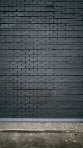 black brick wall and concrete floor