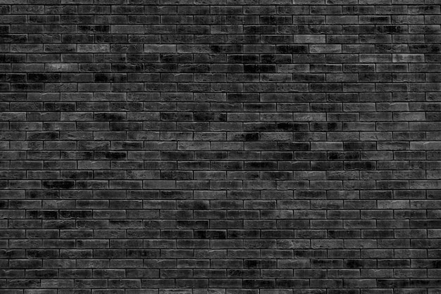 Photo black brick wall. loft interior design. black paint of the facade.