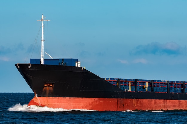 Black bulker ship. Logistics and merchandise transportations