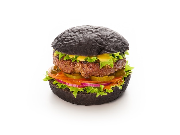 Black burger with beef meat cheese lettuce onion, tomato isolated, fast food and take away delivery concept