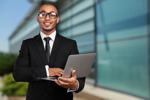 Black business man with laptop