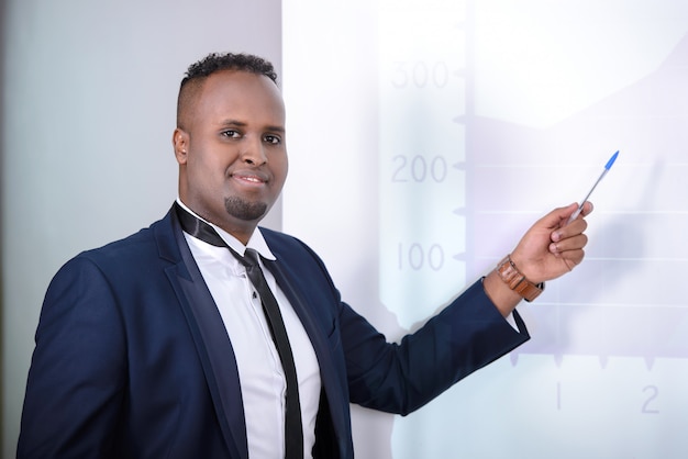 Black businessman giving presentation to his colleagues