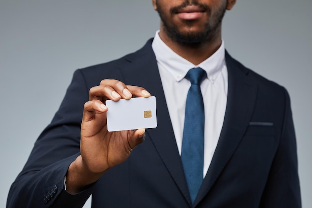 Black Businessman Showing Credit Card