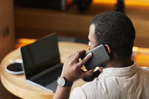 Black Businessman Working in Cafe