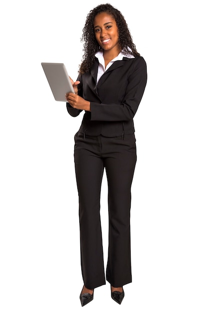 black businesswoman typing on digital tablet