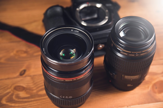 Black camera and lens on the table