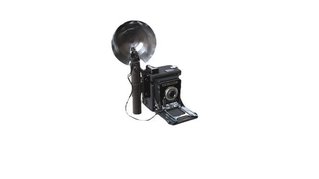 A black camera with a bell on it